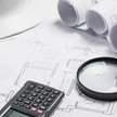 629db9ce-c38b-4da2-8f2c-e8d9f2b5f736-different-blueprints-supplies-office-table.jpg